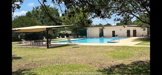 6803 Fence Line Dr, Austin, TX 78749 - community pool featuring a lawn and a patio