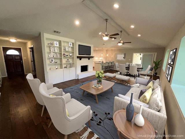 6803 Fence Line Dr, Austin, TX 78749 - living area featuring wood finished floors, a fireplace with raised hearth, ceiling fan, recessed lighting, and baseboards