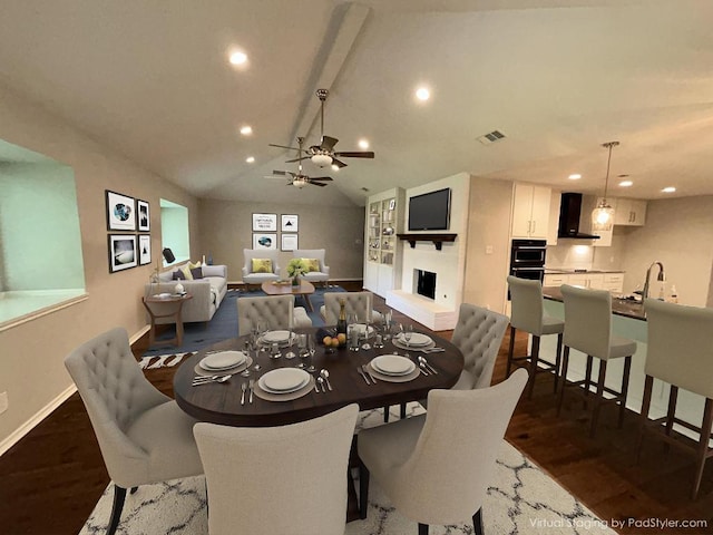 6803 Fence Line Dr, Austin, TX 78749 - dining space with baseboards, dark wood finished floors, recessed lighting, a fireplace with raised hearth, and a ceiling fan
