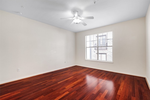 empty room with hardwood / wood-style flooring and ceiling fan