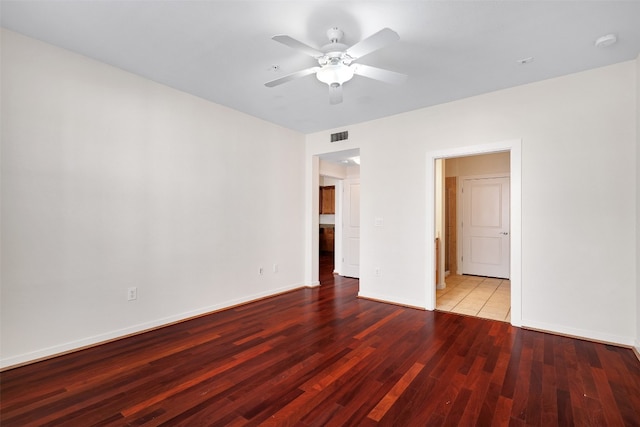 unfurnished room featuring hardwood / wood-style floors and ceiling fan