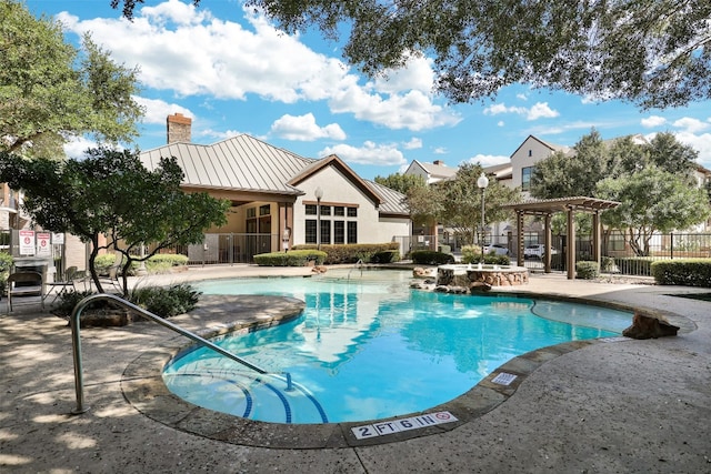 view of swimming pool featuring a pergola and a patio area