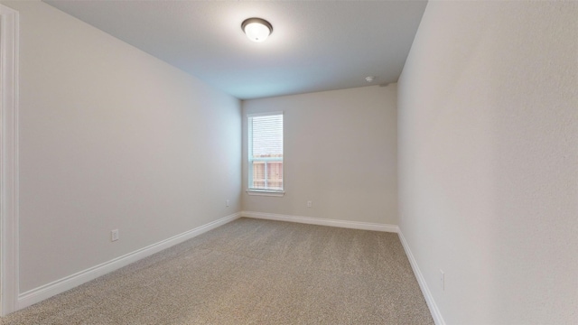 unfurnished room with carpet floors