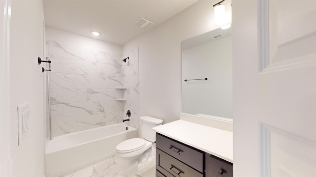 full bathroom featuring vanity, tiled shower / bath combo, and toilet