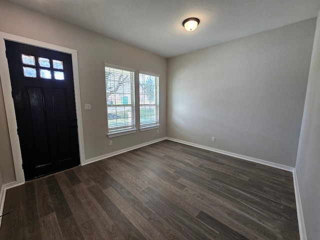 foyer entrance with dark hardwood / wood-style floors