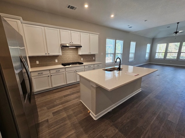 1709 Garret Oaks Ln, Georgetown, TX 78633 - kitchen featuring appliances with stainless steel finishes, under cabinet range hood, plenty of natural light, tasteful backsplash, and recessed lighting