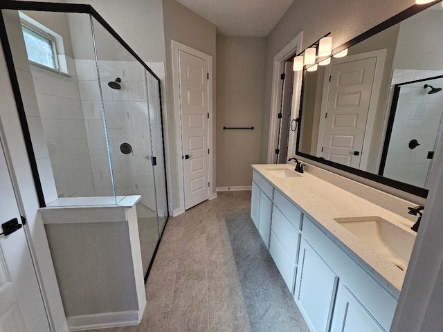 bathroom with vanity and an enclosed shower