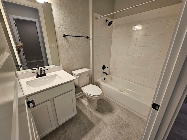 full bathroom featuring vanity, toilet, and tiled shower / bath