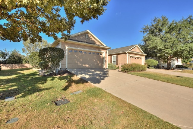 ranch-style house with a front yard and a garage