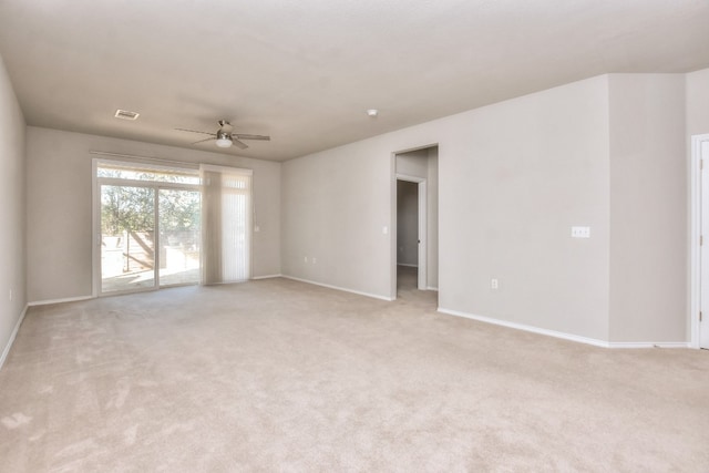 carpeted empty room featuring ceiling fan