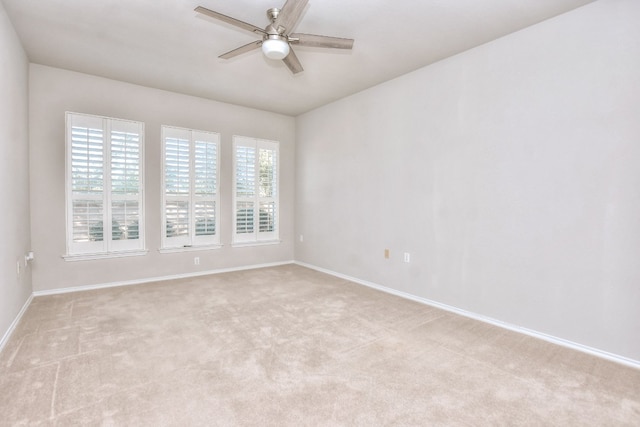 carpeted empty room with ceiling fan