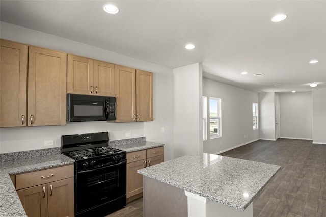 196 Lavender Ln, Elgin, TX 78621 - kitchen featuring open floor plan, recessed lighting, a center island, dark wood-type flooring, and black appliances