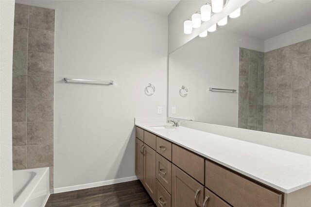 196 Lavender Ln, Elgin, TX 78621 - full bath featuring vanity and wood finished floors