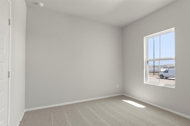 196 Lavender Ln, Elgin, TX 78621 - spare room featuring carpet flooring and baseboards