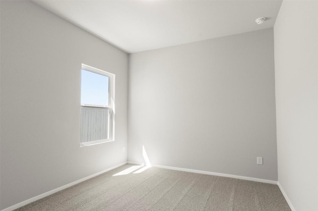 196 Lavender Ln, Elgin, TX 78621 - spare room featuring baseboards and carpet