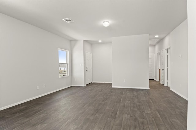 196 Lavender Ln, Elgin, TX 78621 - empty room with dark wood finished floors, baseboards, visible vents, and recessed lighting