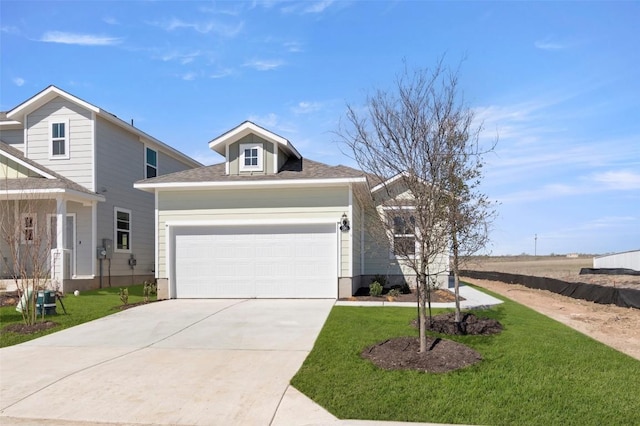 196 Lavender Ln, Elgin, TX 78621 - view of front of home with driveway, a shingled roof, a garage, and a front yard