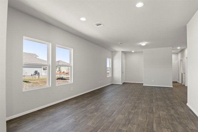 196 Lavender Ln, Elgin, TX 78621 - unfurnished room with recessed lighting, baseboards, and dark wood finished floors