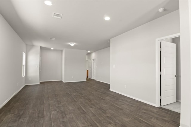 196 Lavender Ln, Elgin, TX 78621 - unfurnished room featuring recessed lighting, dark wood-style floors, baseboards, and visible vents
