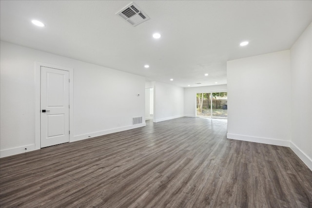 spare room with dark hardwood / wood-style flooring