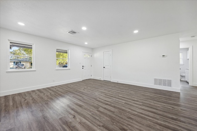 empty room with dark wood-type flooring