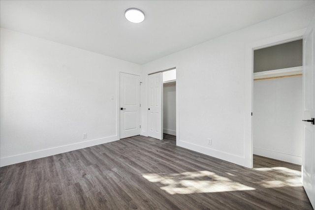 unfurnished bedroom with dark hardwood / wood-style flooring