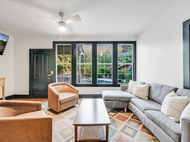 living room featuring hardwood / wood-style flooring and ceiling fan