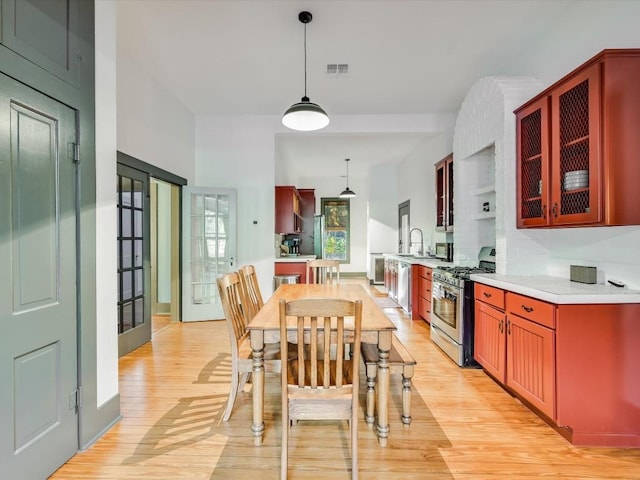 dining room with visible vents and light wood finished floors