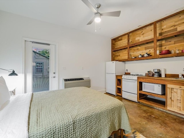 bedroom featuring freestanding refrigerator, heating unit, concrete flooring, an AC wall unit, and a ceiling fan