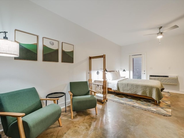 bedroom with finished concrete floors, a wall mounted air conditioner, baseboards, and a ceiling fan