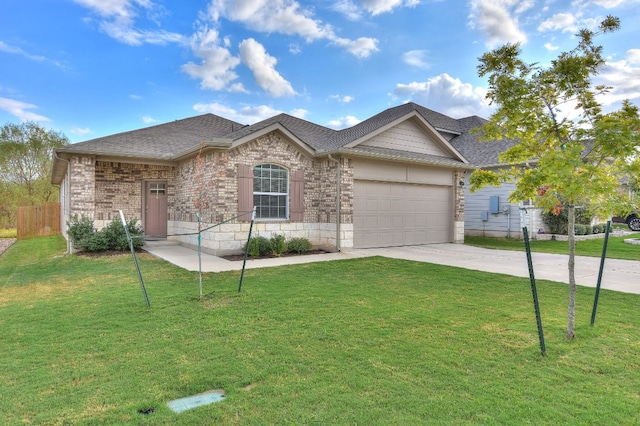 ranch-style home with a front yard and a garage