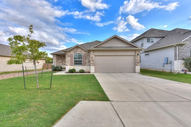 view of front of house featuring a front yard and a garage