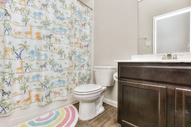 full bathroom with hardwood / wood-style flooring, shower / bath combination with curtain, toilet, and vanity