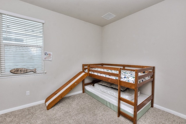 bedroom with light carpet