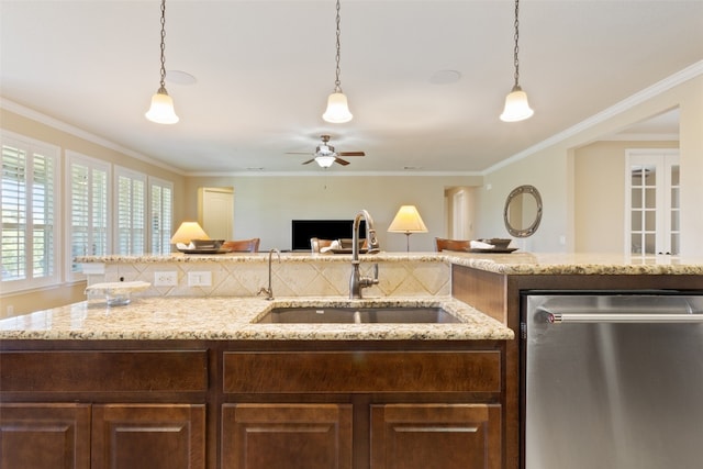 kitchen with sink, dishwasher, crown molding, and pendant lighting