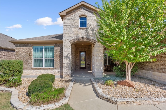 property entrance featuring a patio