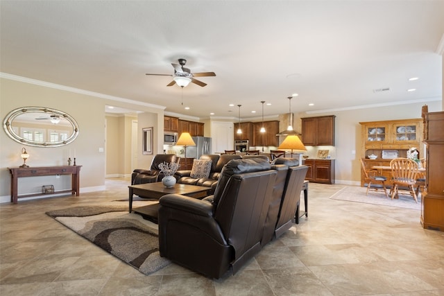 living room with ornamental molding and ceiling fan