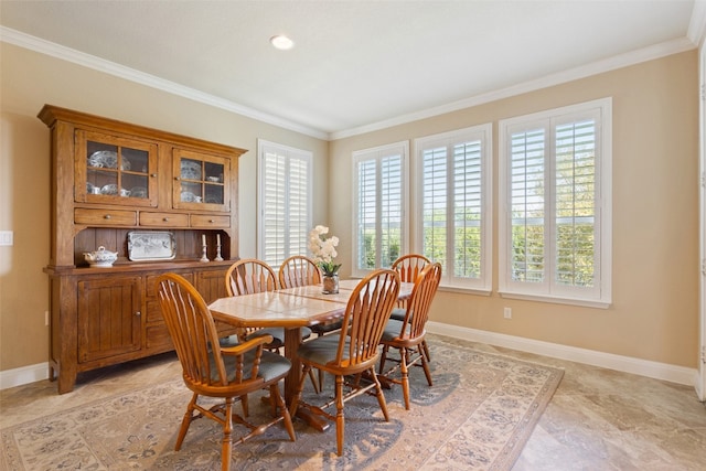 dining space featuring ornamental molding