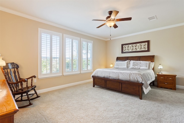 bedroom with crown molding, light colored carpet, and ceiling fan