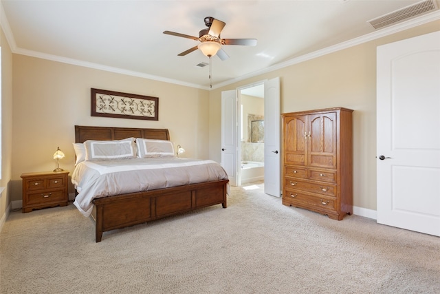 bedroom with ensuite bath, light carpet, crown molding, and ceiling fan