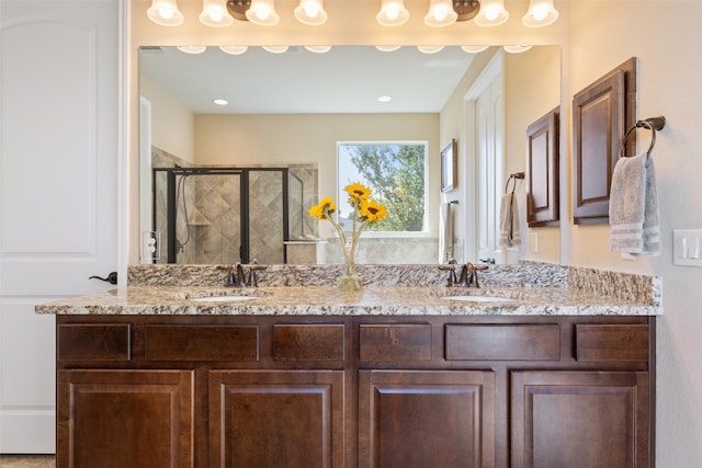 bathroom with vanity and an enclosed shower