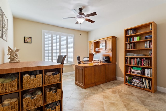 office space with light tile patterned floors and ceiling fan