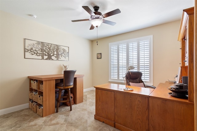 tiled office space with ceiling fan