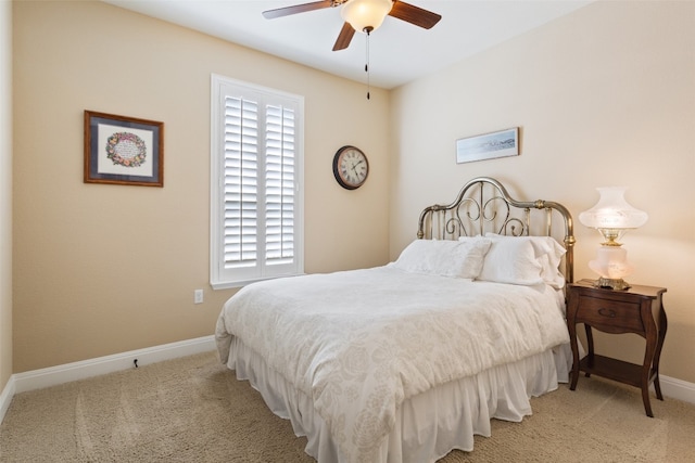 bedroom featuring light colored carpet and ceiling fan