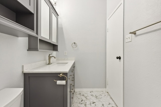 bathroom with toilet and vanity