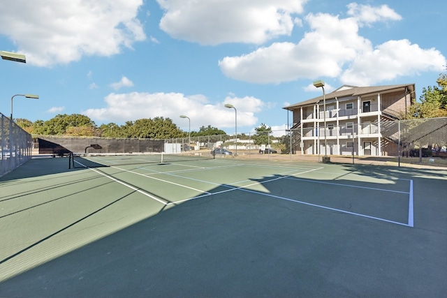 view of sport court featuring basketball hoop