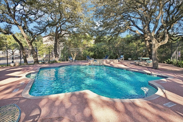 view of swimming pool featuring a patio