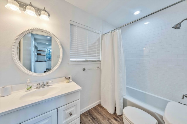 full bathroom with vanity, shower / bath combo with shower curtain, hardwood / wood-style flooring, and toilet