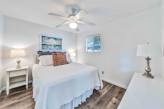 bedroom with ceiling fan and dark hardwood / wood-style flooring