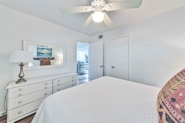 bedroom featuring dark hardwood / wood-style flooring and ceiling fan